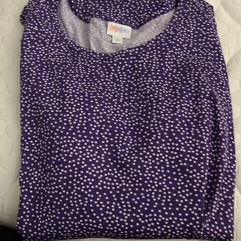 Purple and white polka dot. Long sleeve.